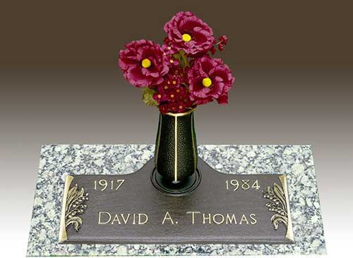 curved bronze memorial around vase