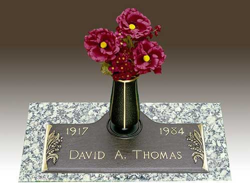 curved bronze memorial around vase